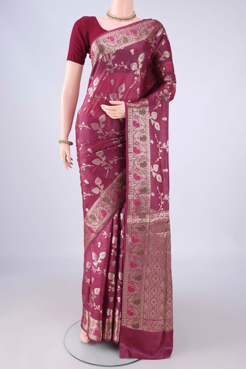 Magenta Banarasi Tussar Silk Saree with Zari And Thread Butta on the body and Zari Border.  displayed on a mannequin