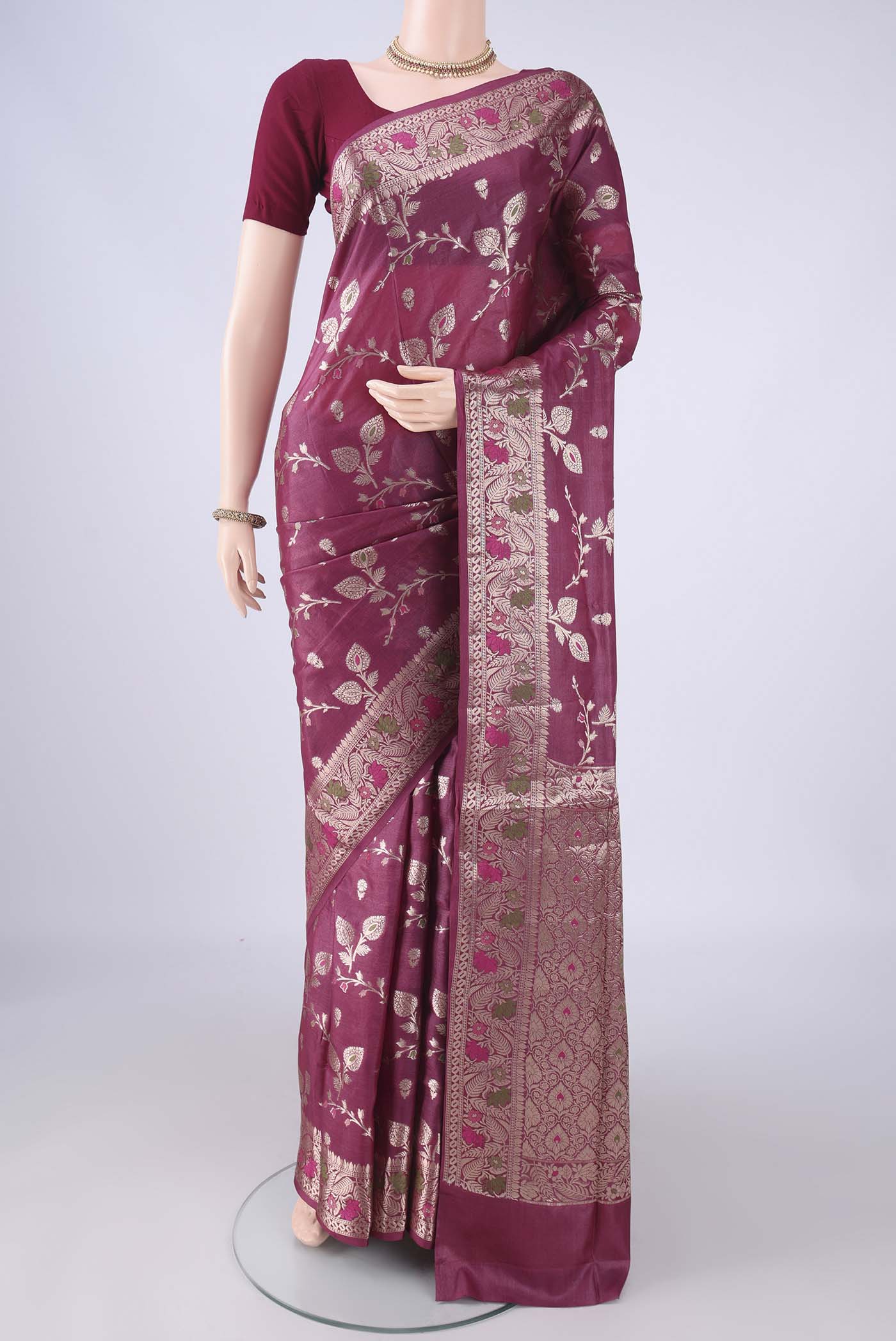 Magenta Banarasi Tussar Silk Saree with Zari And Thread Butta on the body and Zari Border.  displayed on a mannequin