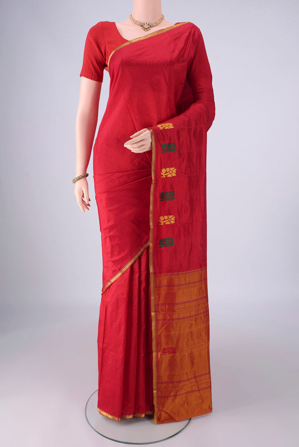 Red Kanchipuram Silk Saree with Plain Body and Thread Border.  displayed on a mannequin