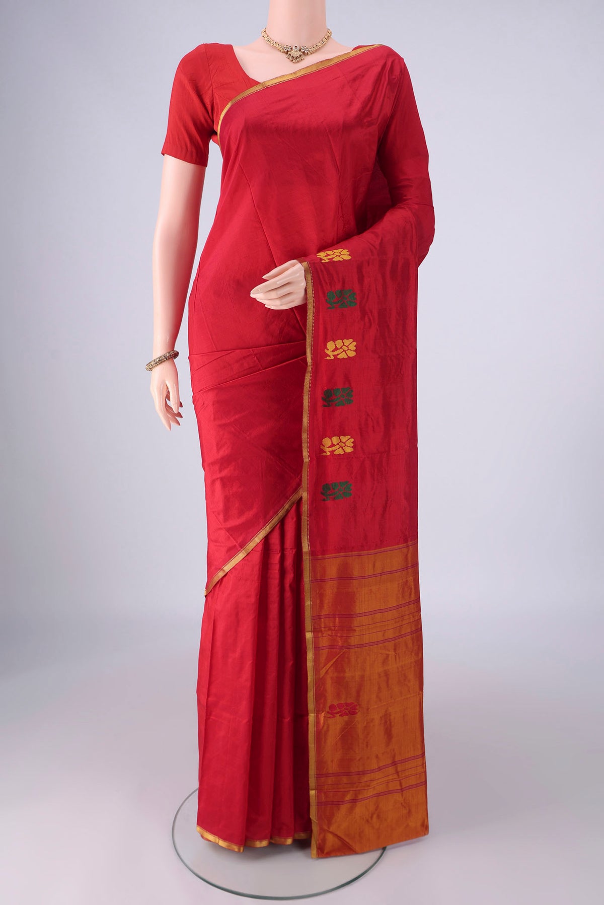 Red Kanchipuram Silk Saree with Plain Body and Thread Border.  displayed on a mannequin