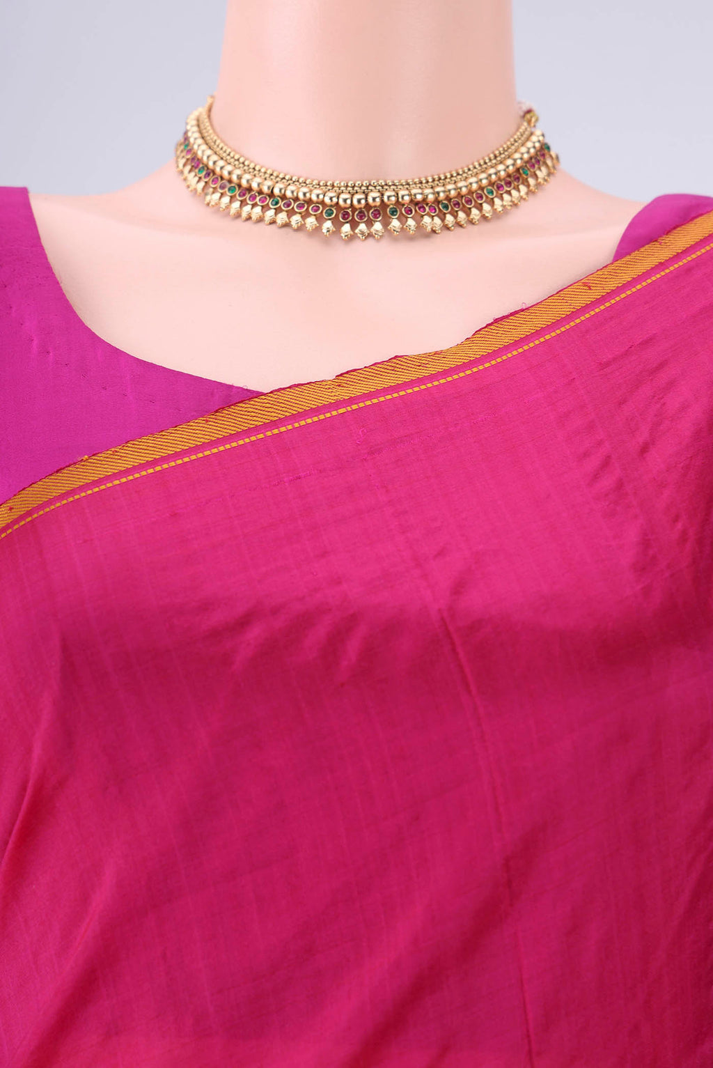 Border image of Rani Pink Kanchipuram Silk Saree with Plain Body and Thread Border. 