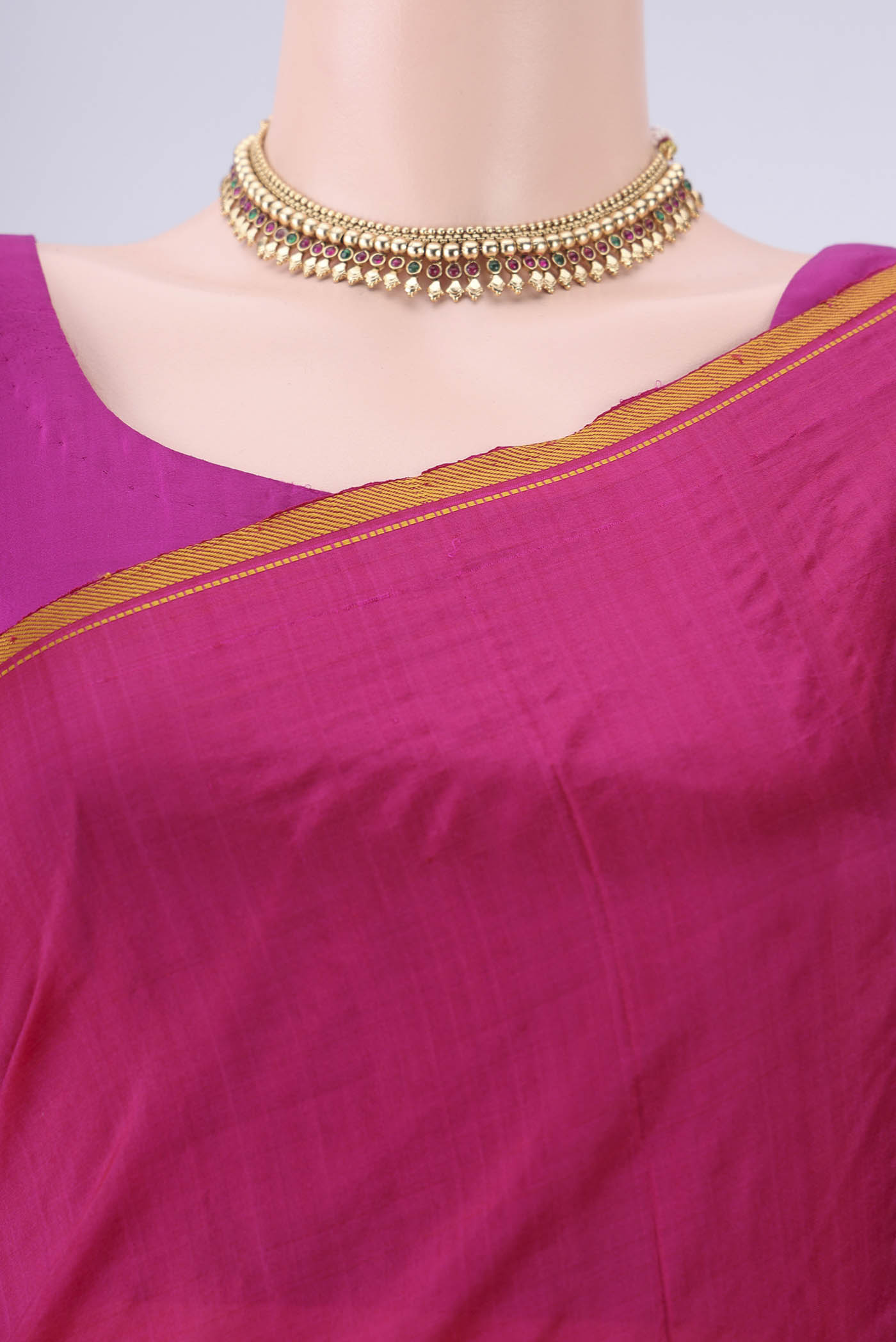 Border image of Rani Pink Kanchipuram Silk Saree with Plain Body and Thread Border. 