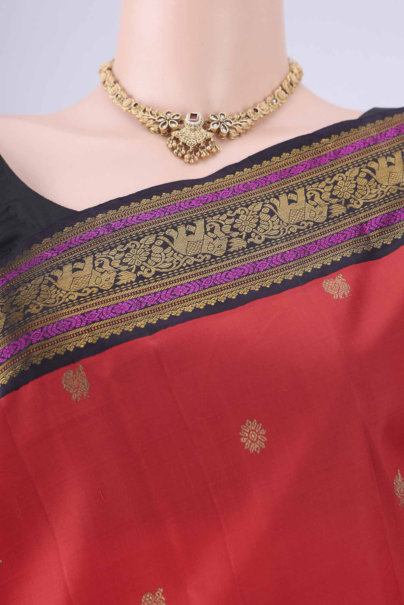 Border image of Orange Kanjivaram Silk Saree with Zari Butta on the body and Zari Border. 