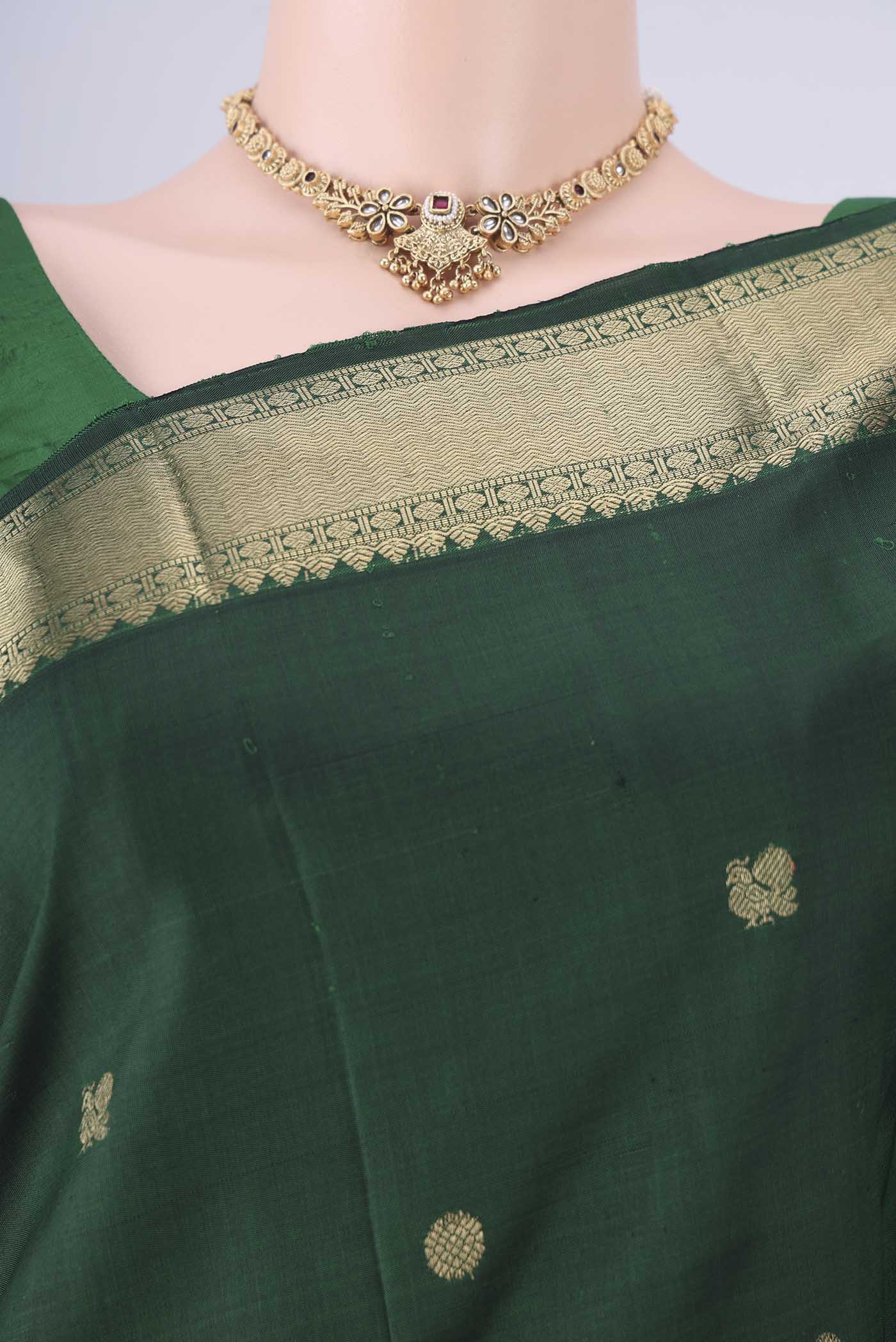 Border image of Bottle Green Kanjivaram Silk Saree with Zari Butta on the body and Zari Border. 