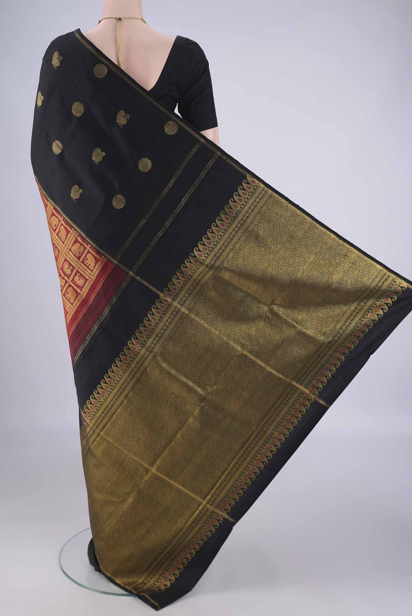 Flat view of Multi Color Kanjivaram Silk Saree with Zari Butta on the body and Zari Border. 