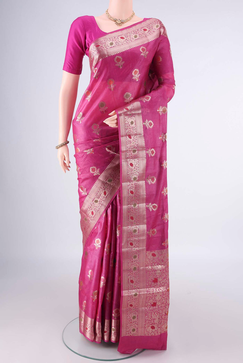Rani Pink Banarasi Tussar Saree with Zari And Thread Butta on the body and Zari And Thread Border.  displayed on a mannequin