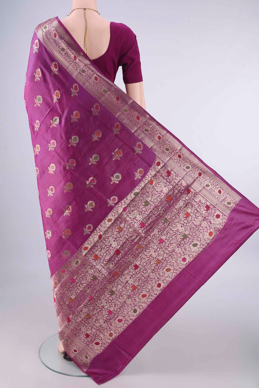 Flat view of Magenta Banarasi Tussar Saree with Zari And Thread Butta on the body and Zari And Thread Border. 