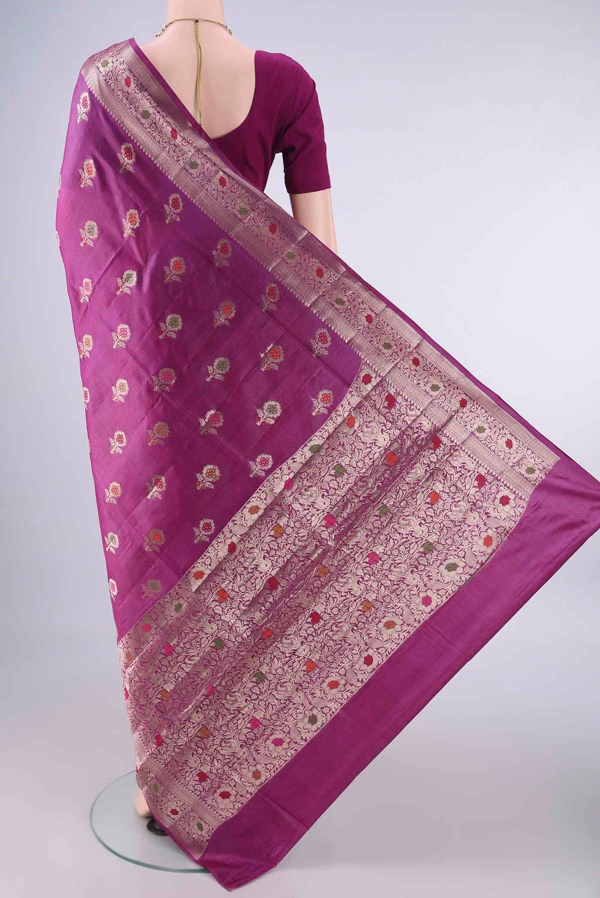 Flat view of Magenta Banarasi Tussar Saree with Zari And Thread Butta on the body and Zari And Thread Border. 