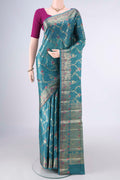 Sea Green Banarasi Tussar Saree with Zari And Thread Butta on the body and Zari And Thread Border.  displayed on a mannequin