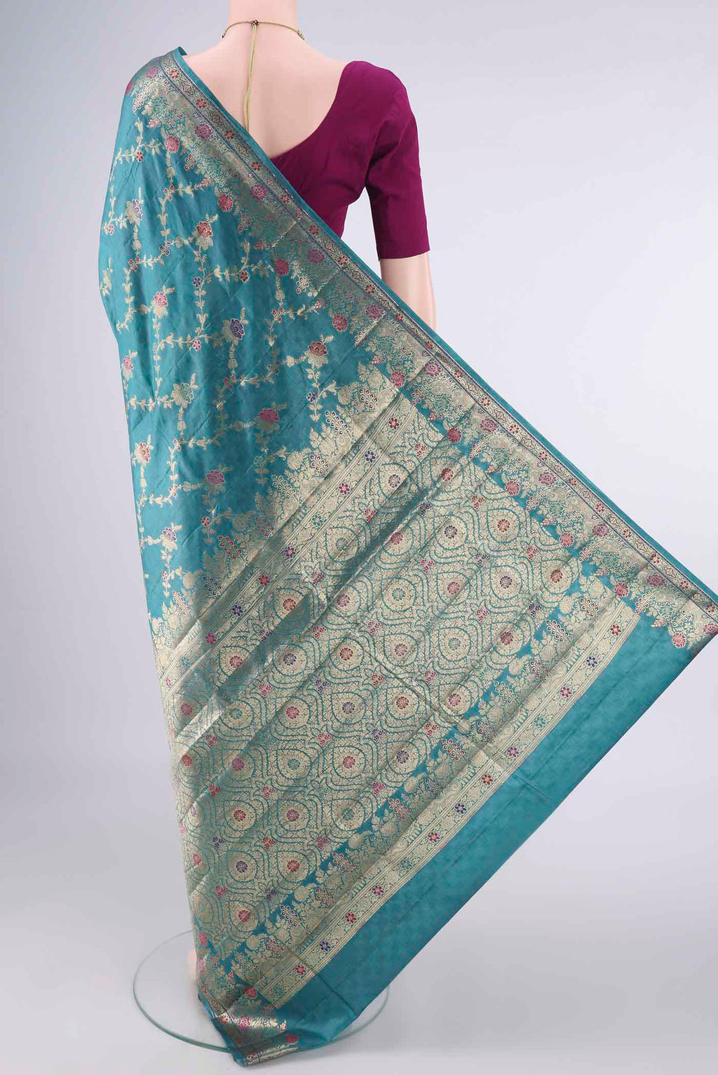 Flat view of Sea Green Banarasi Tussar Saree with Zari And Thread Butta on the body and Zari And Thread Border. 
