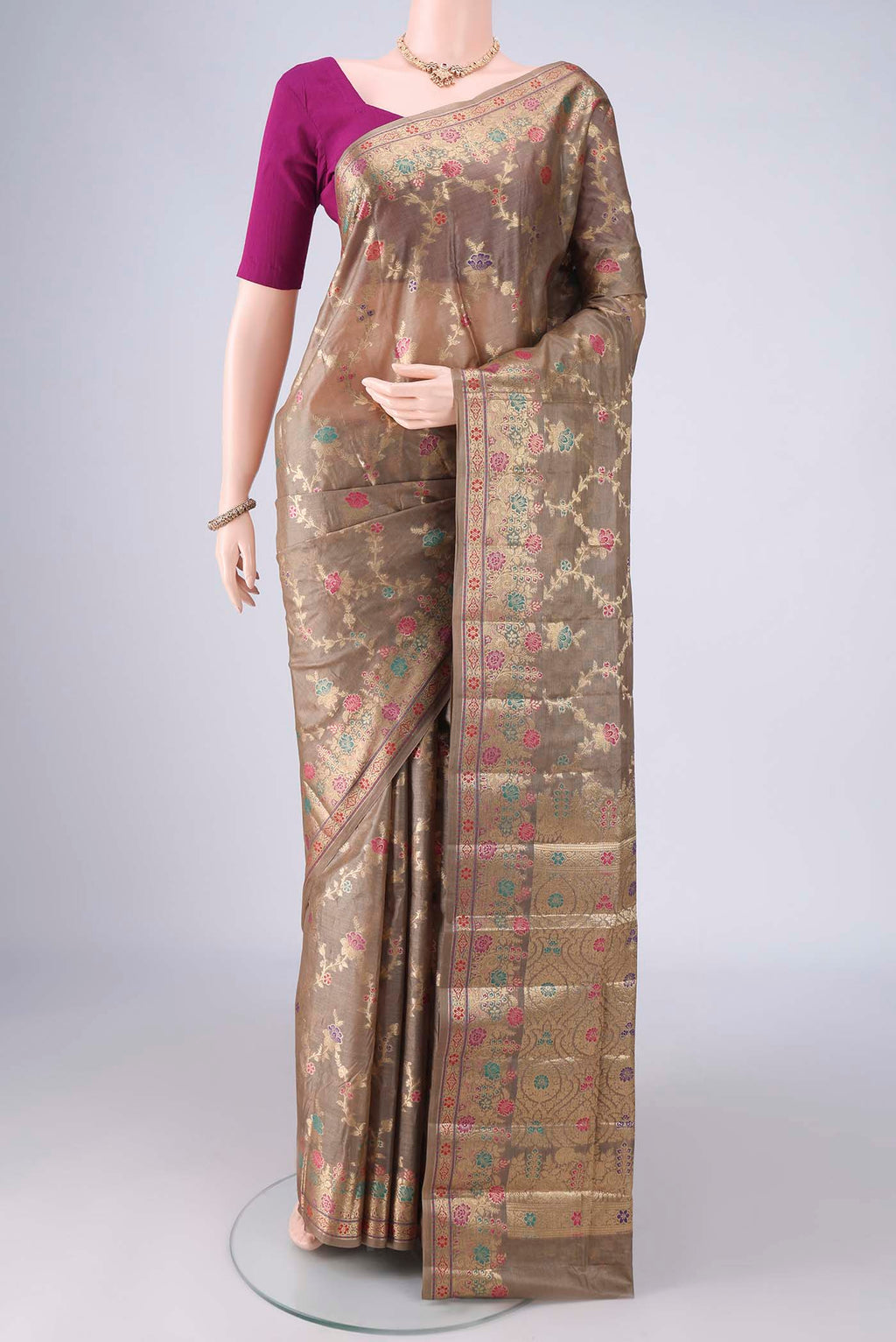Dark Beige Banarasi Tussar Saree with Zari Brocade on the body and Zari And Thread Border.  displayed on a mannequin