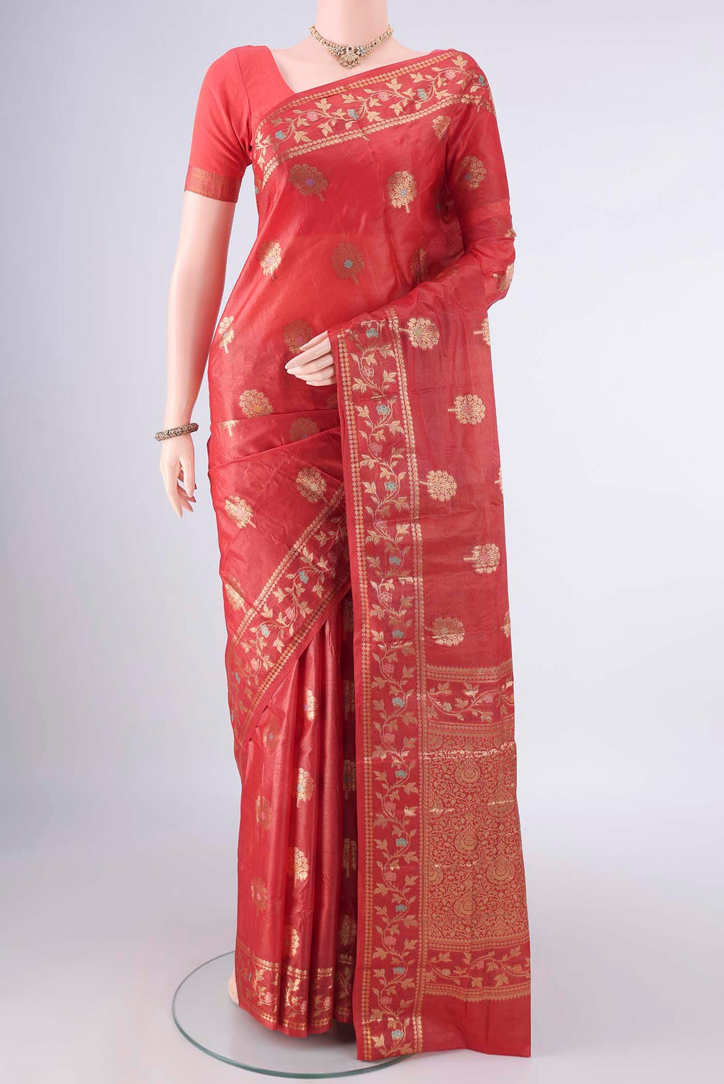 Red Banarasi Tussar Saree with Zari And Thread Butta on the body and Zari And Thread Border.  displayed on a mannequin