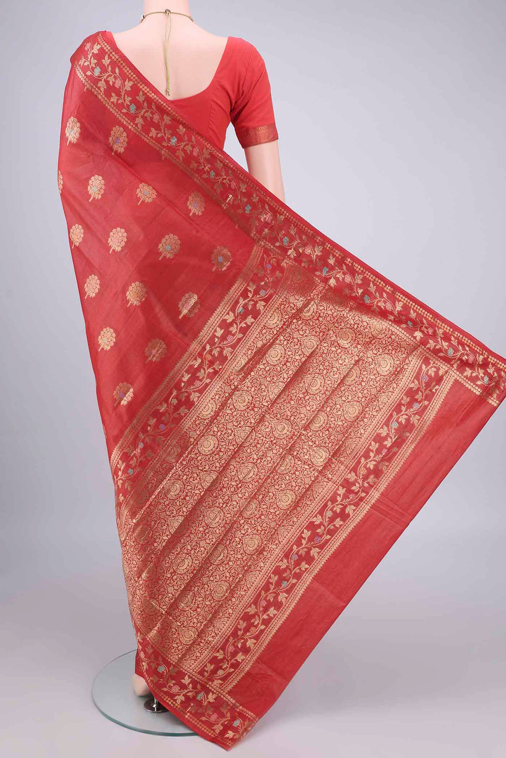Flat view of Red Banarasi Tussar Saree with Zari And Thread Butta on the body and Zari And Thread Border. 