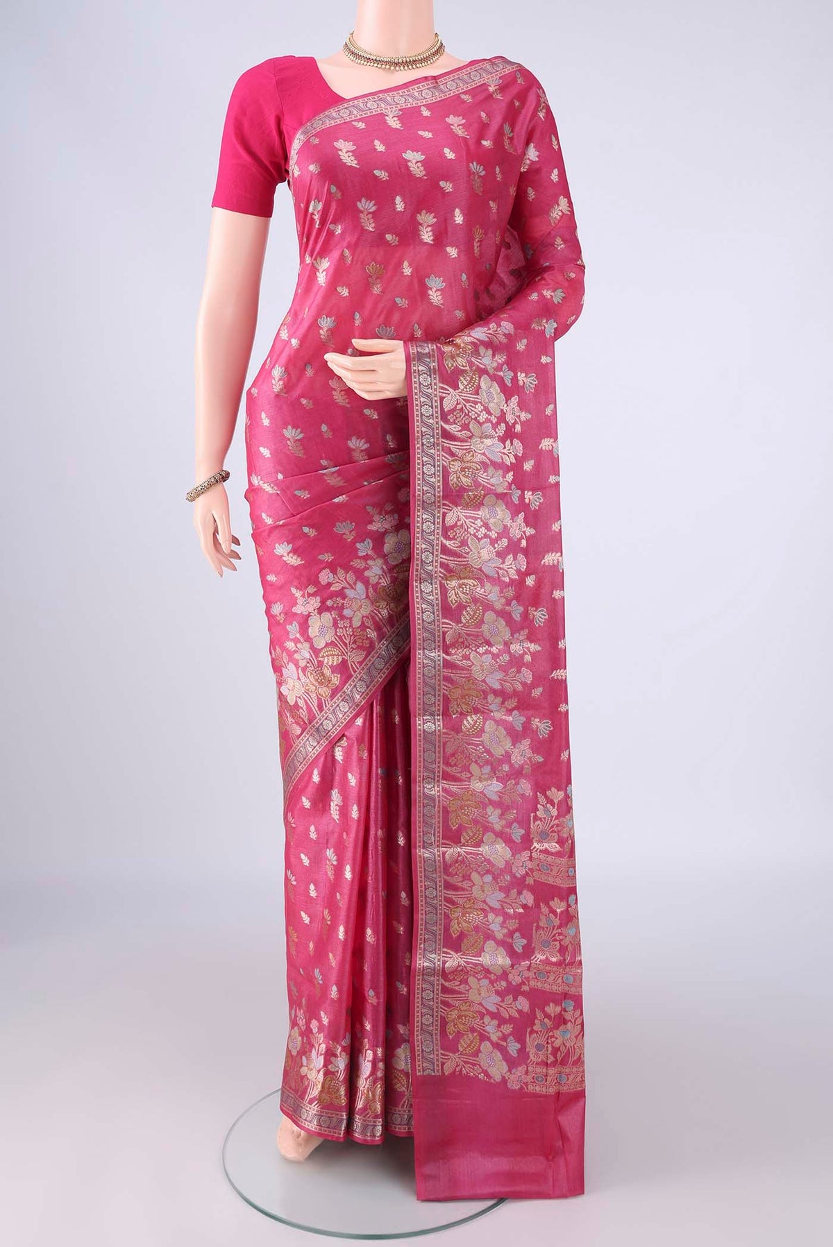 Pink Banarasi Tussar Silk Saree with Zari And Thread Butta on the body and Zari Border.  displayed on a mannequin