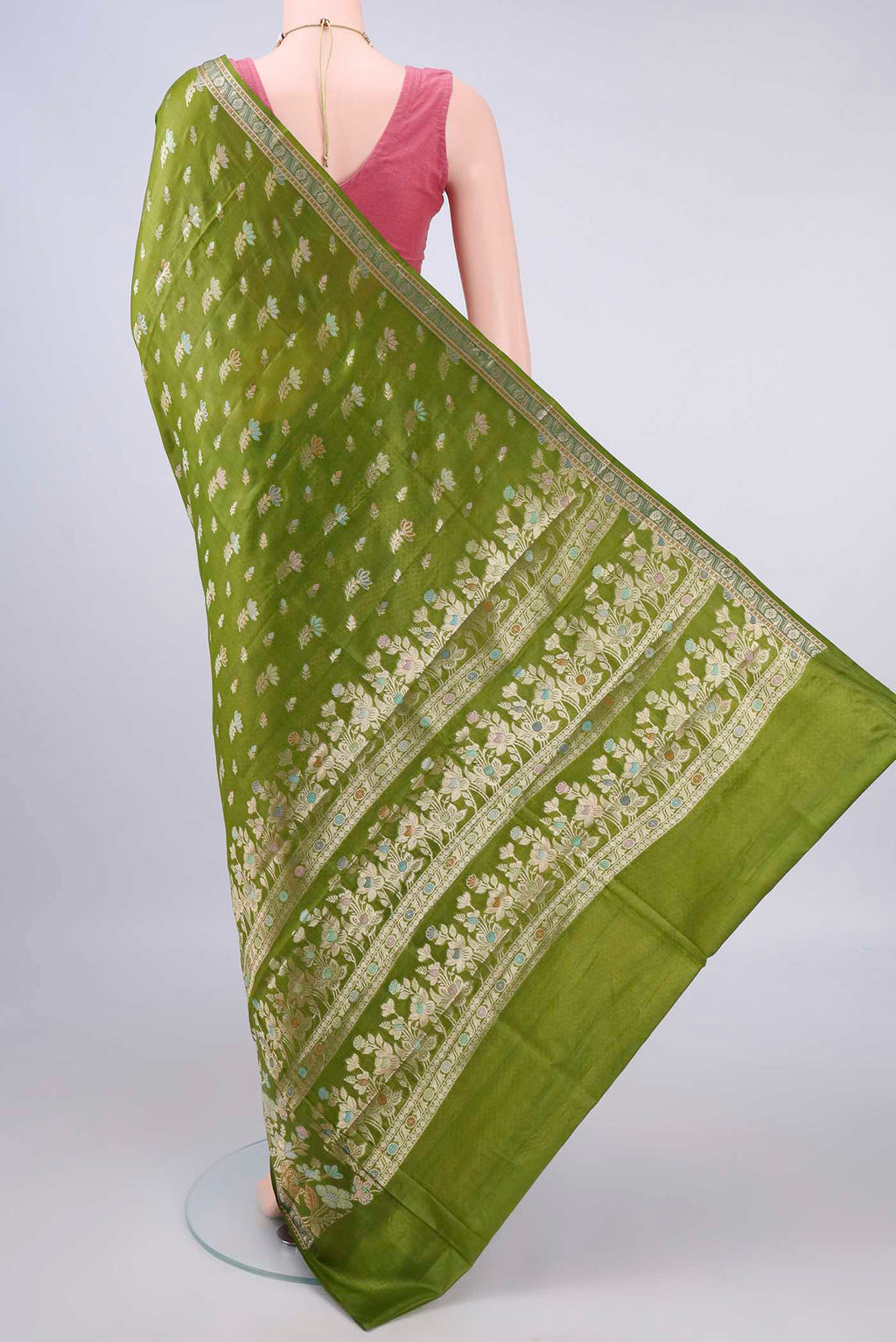 Flat view of Green Banarasi Tussar Saree with Zari And Thread Butta on the body and Zari Border. 