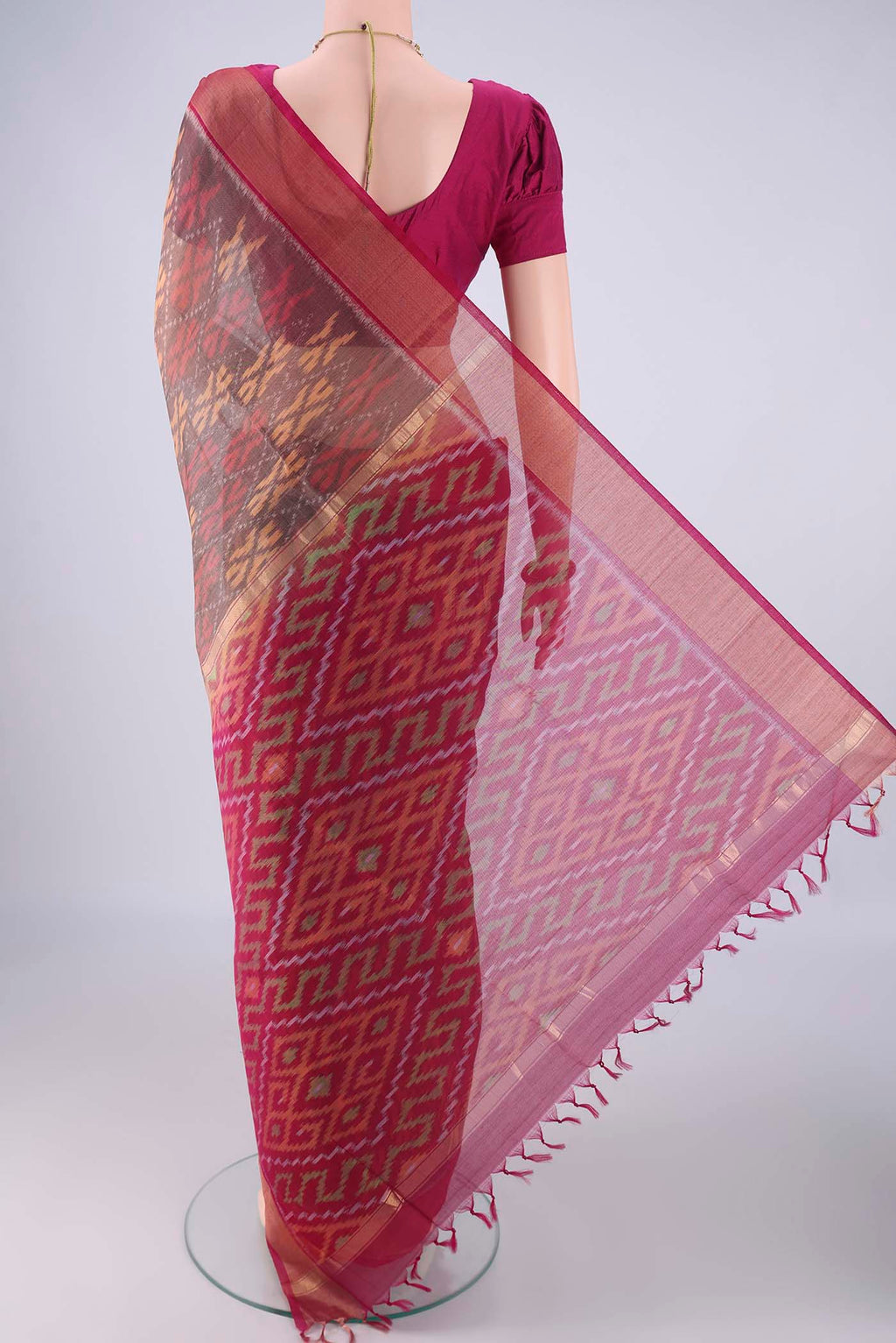 Flat view of Davys Grey Silk Cotton Saree with Ikat design on the body and Zari Border. 