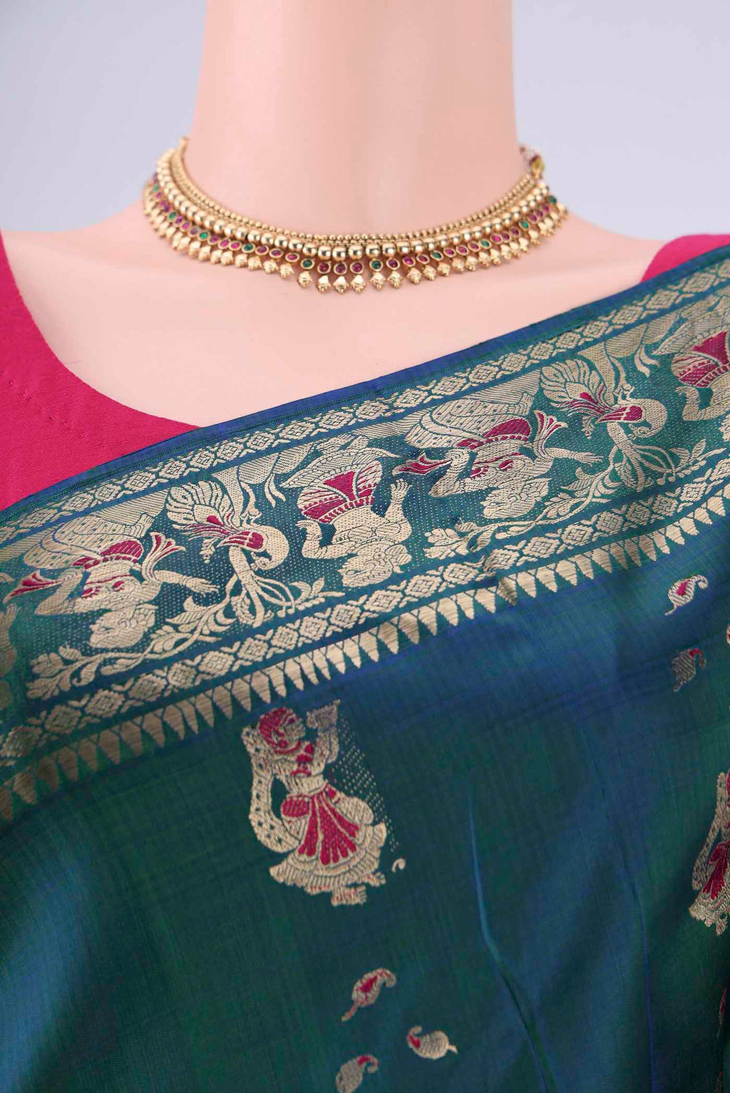 Border image of Peacock Blue Dual Tone Baluchari Silk Saree with Zari And Thread Butta on the body and Zari And Thread Border. 
