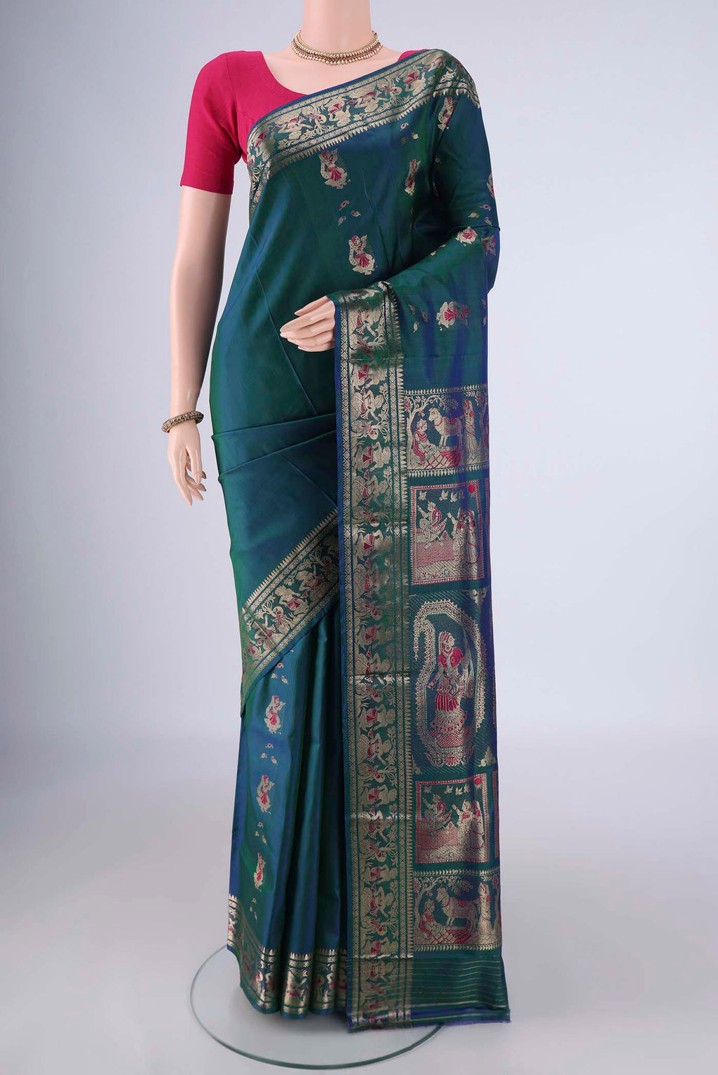 Peacock Blue Dual Tone Baluchari Silk Saree with Zari And Thread Butta on the body and Zari And Thread Border.  displayed on a mannequin
