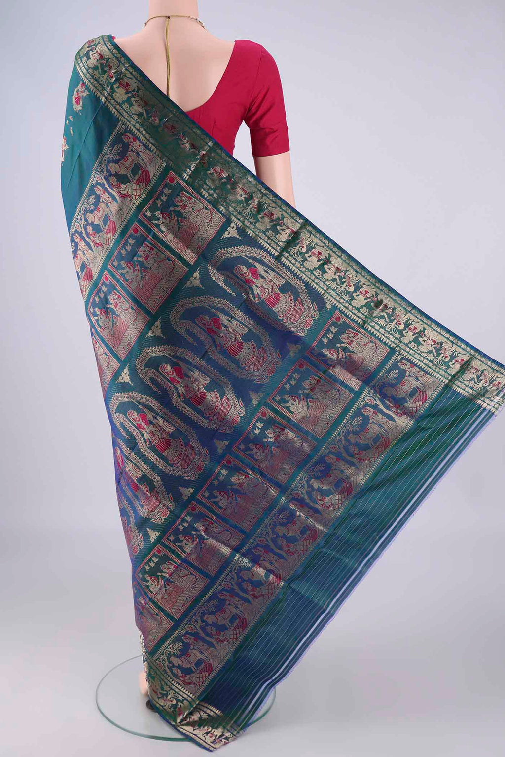 Flat view of Peacock Blue Dual Tone Baluchari Silk Saree with Zari And Thread Butta on the body and Zari And Thread Border. 