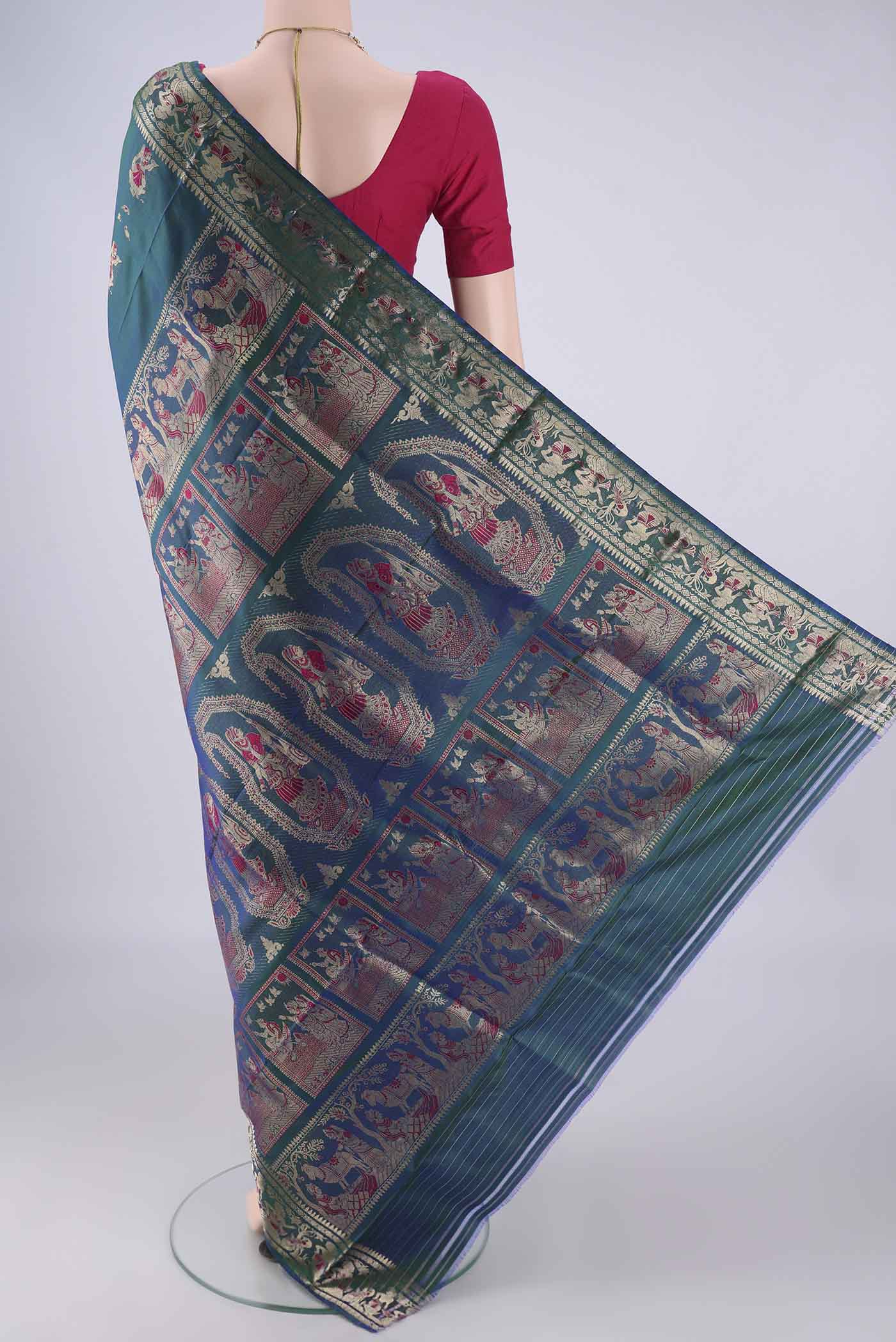 Flat view of Peacock Blue Dual Tone Baluchari Silk Saree with Zari And Thread Butta on the body and Zari And Thread Border. 