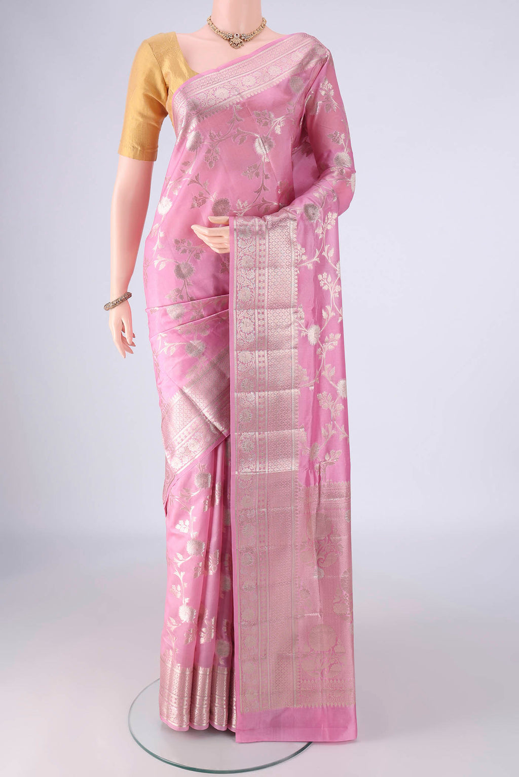 Rose pink Banarasi Raw Silk Saree with Zari Brocade on the body and Zari And Thread Border.  displayed on a mannequin