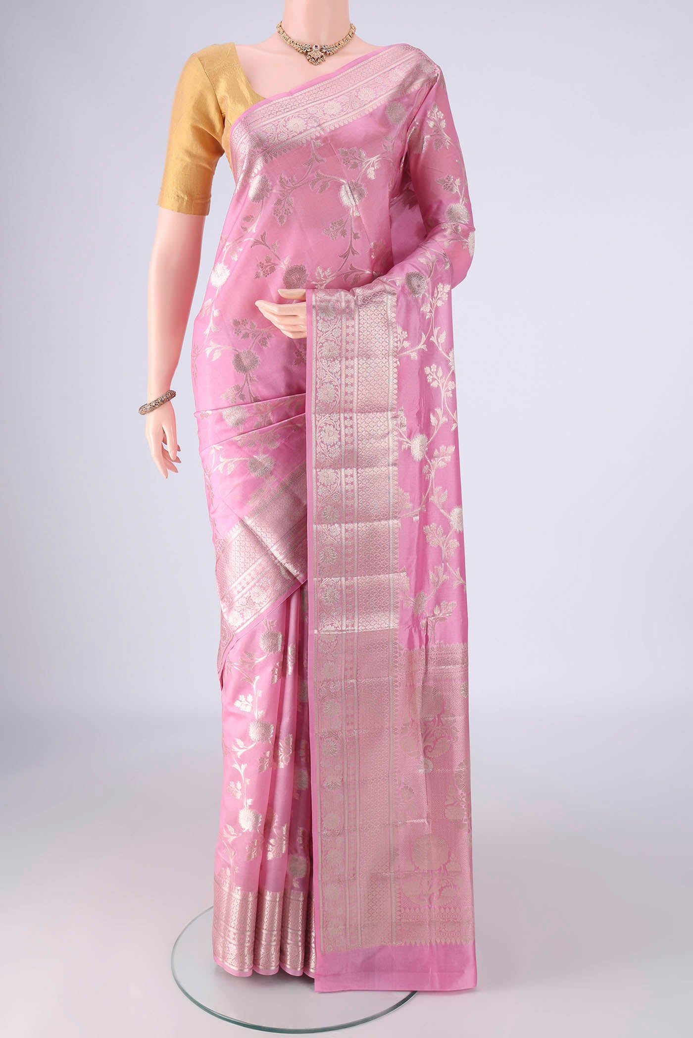 Rose pink Banarasi Raw Silk Saree with Zari Brocade on the body and Zari And Thread Border.  displayed on a mannequin