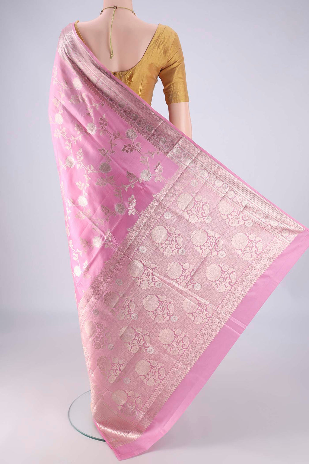 Flat view of Rose pink Banarasi Raw Silk Saree with Zari Brocade on the body and Zari And Thread Border. 