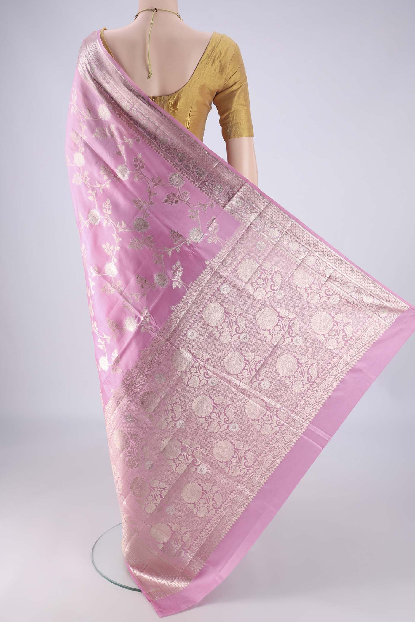 Flat view of Rose pink Banarasi Raw Silk Saree with Zari Brocade on the body and Zari And Thread Border. 