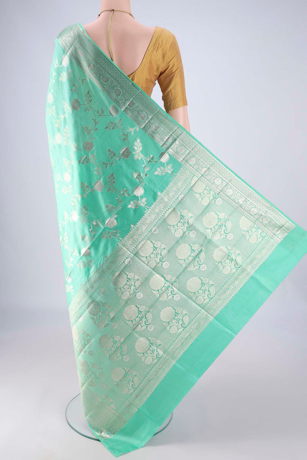 Flat view of Turquoise Banarasi Raw Silk Saree with Zari Brocade on the body and Zari Border. 