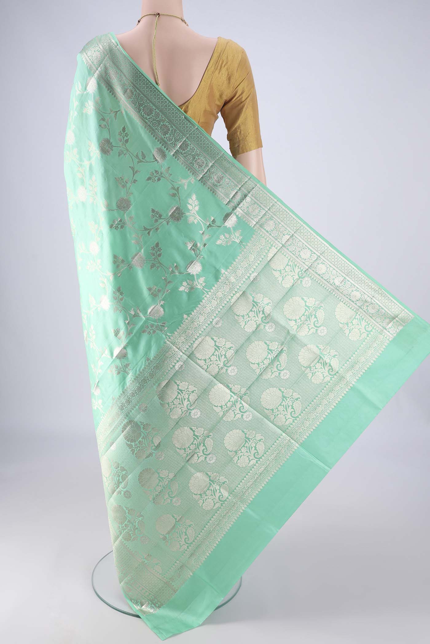 Flat view of Turquoise Banarasi Raw Silk Saree with Zari Brocade on the body and Zari Border. 