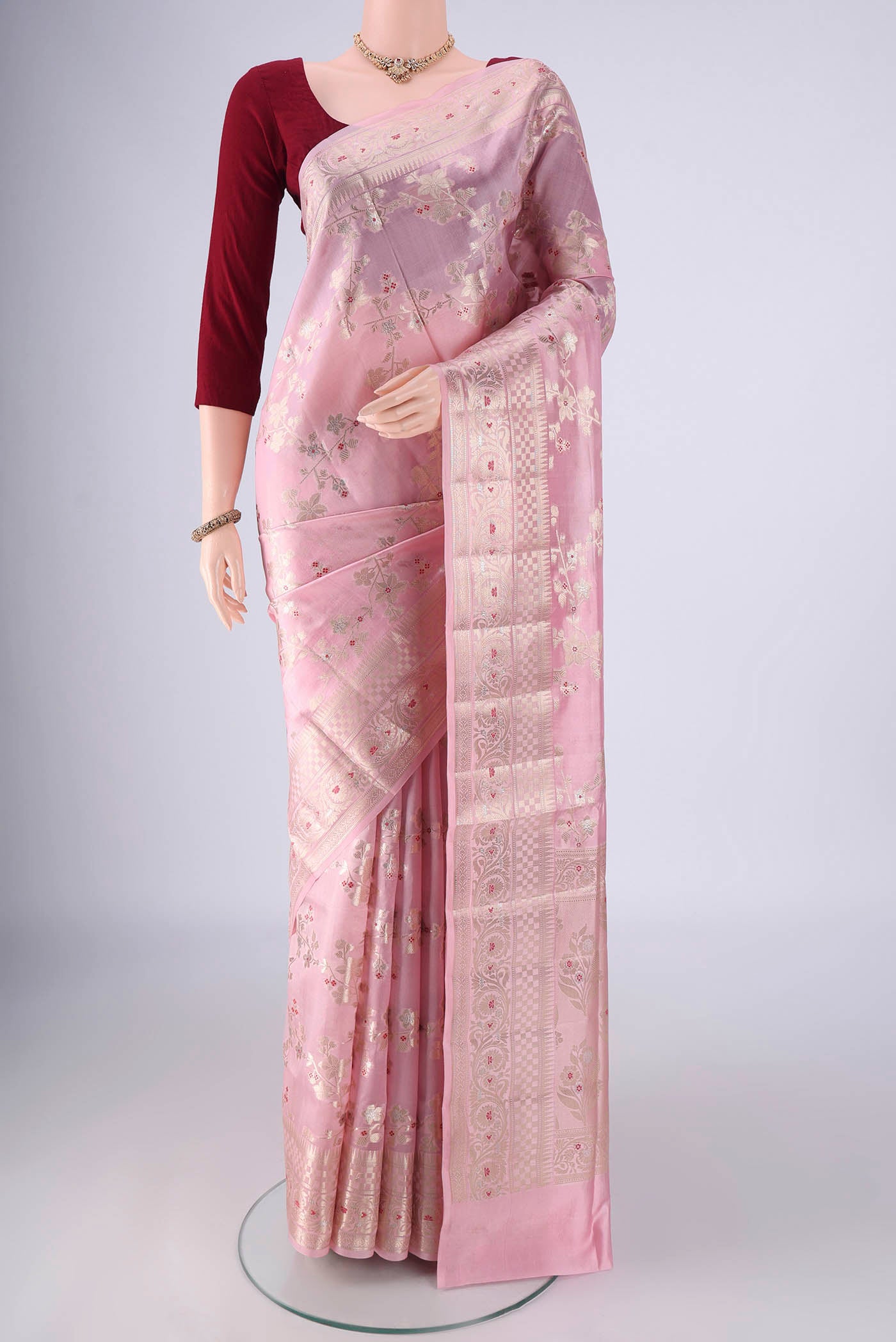 Rose pink Banarasi Raw Silk Saree with Zari And Thread Butta on the body and Zari And Thread Border.  displayed on a mannequin