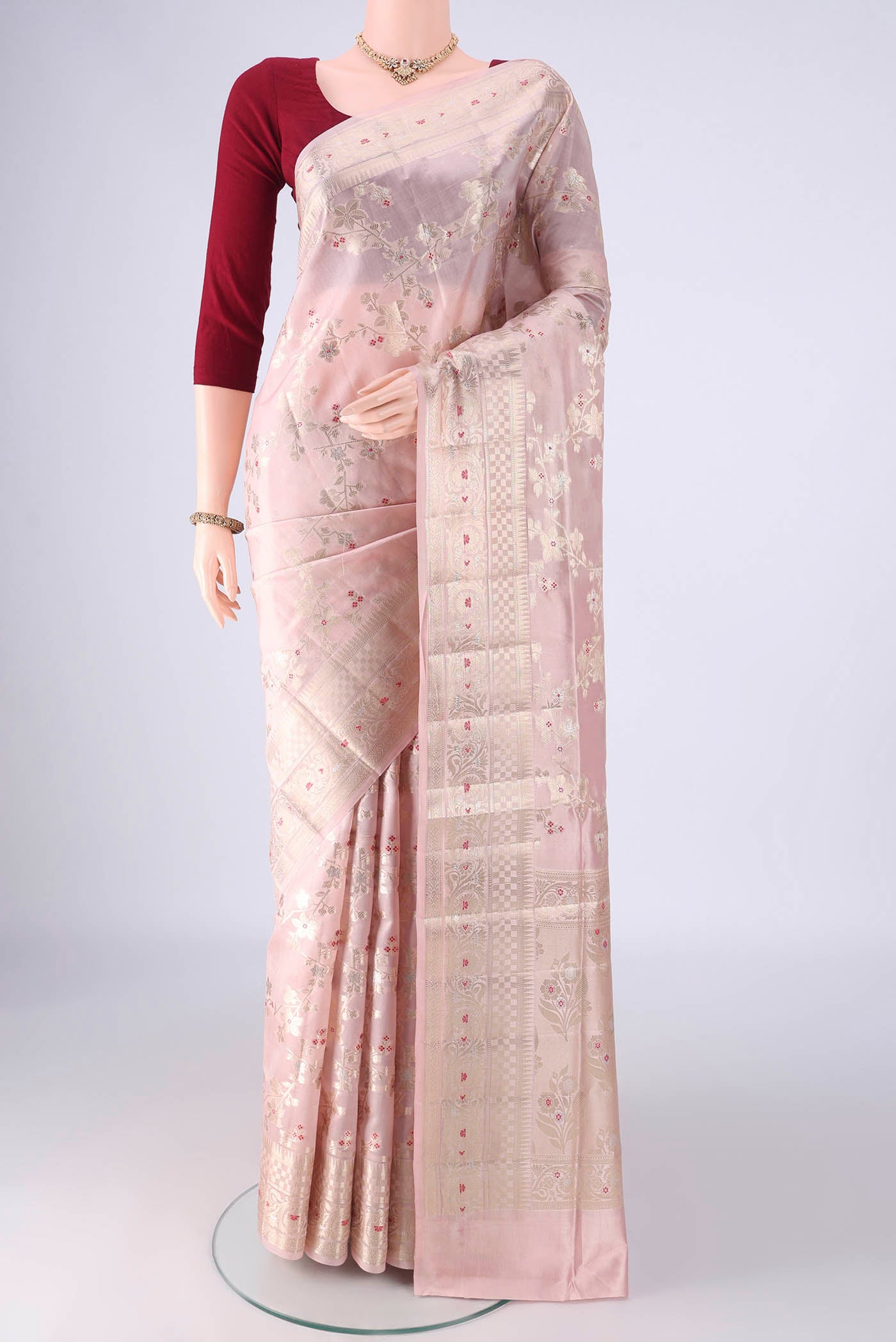 Rose Gold Banarasi Raw Silk Saree with Zari Brocade on the body and Zari And Thread Border.  displayed on a mannequin