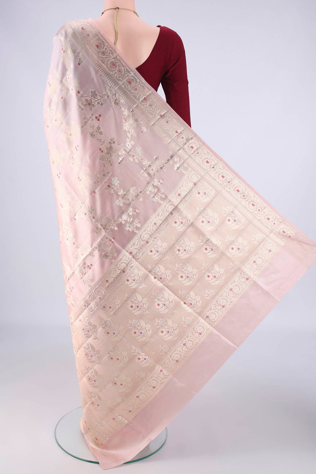 Flat view of Rose Gold Banarasi Raw Silk Saree with Zari Brocade on the body and Zari And Thread Border. 