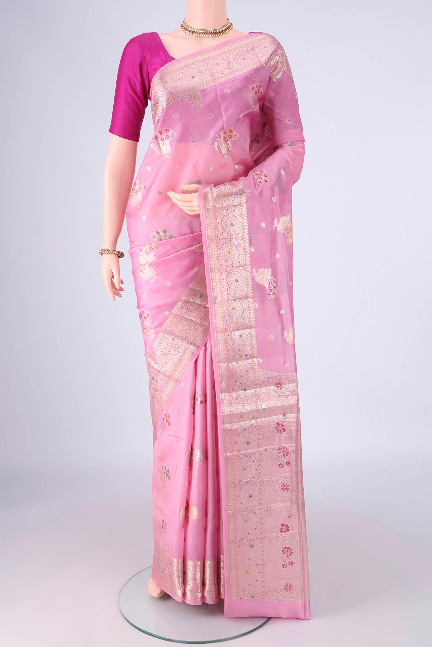 Rose pink Banarasi Raw Silk Saree with Zari And Thread Butta on the body and Zari And Thread Border.  displayed on a mannequin