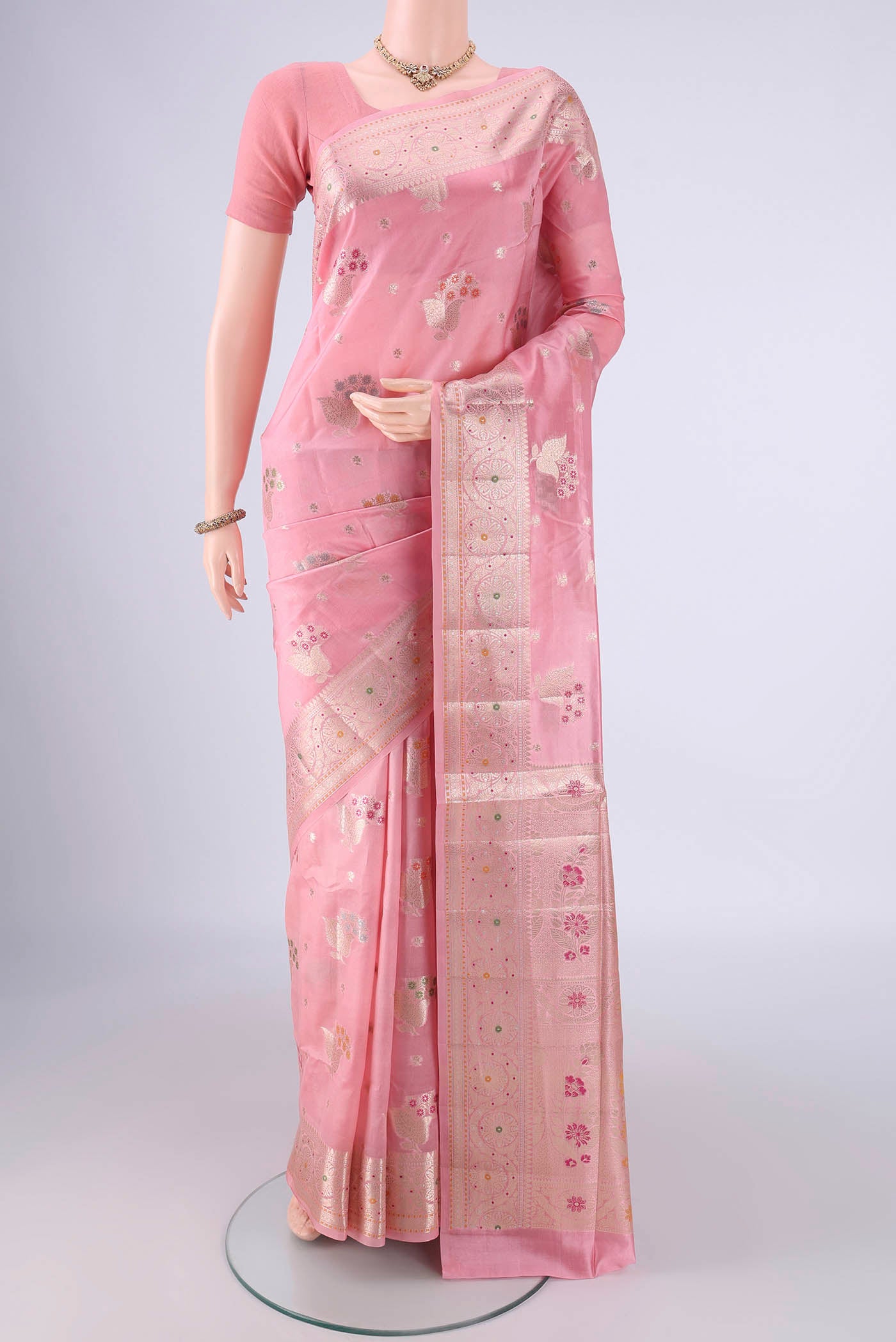 Rose pink Banarasi Raw Silk Saree with Zari And Thread Butta on the body and Zari And Thread Border.  displayed on a mannequin
