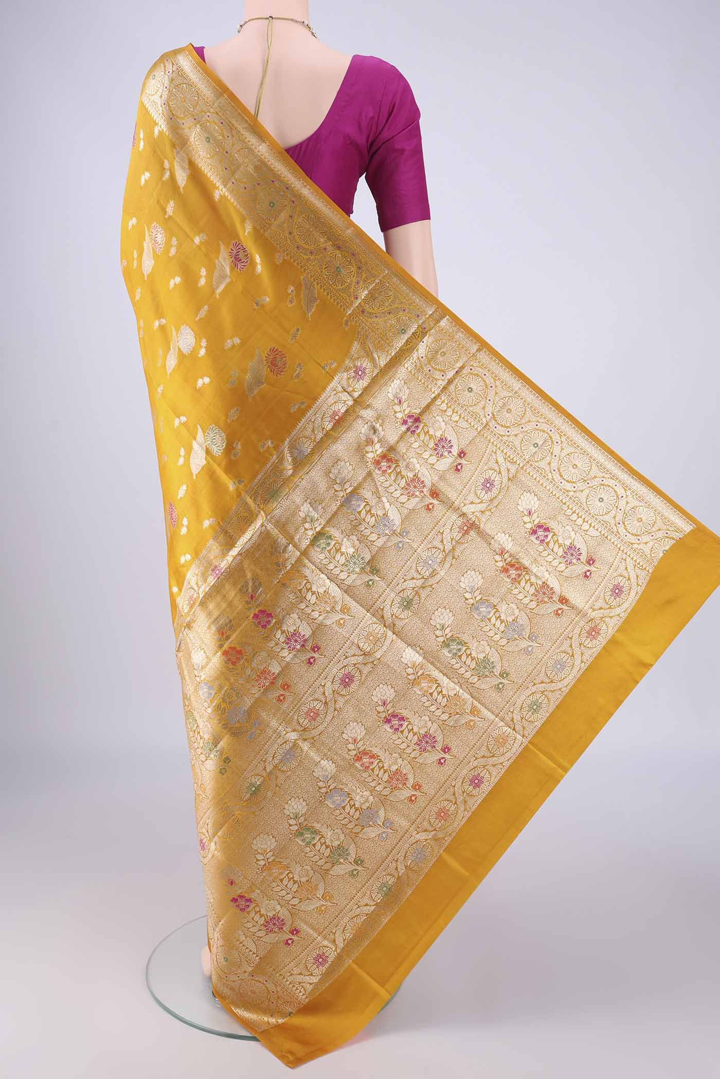 Flat view of Mustard Banarasi Raw Silk Saree with Zari And Thread Butta on the body and Zari Border. 
