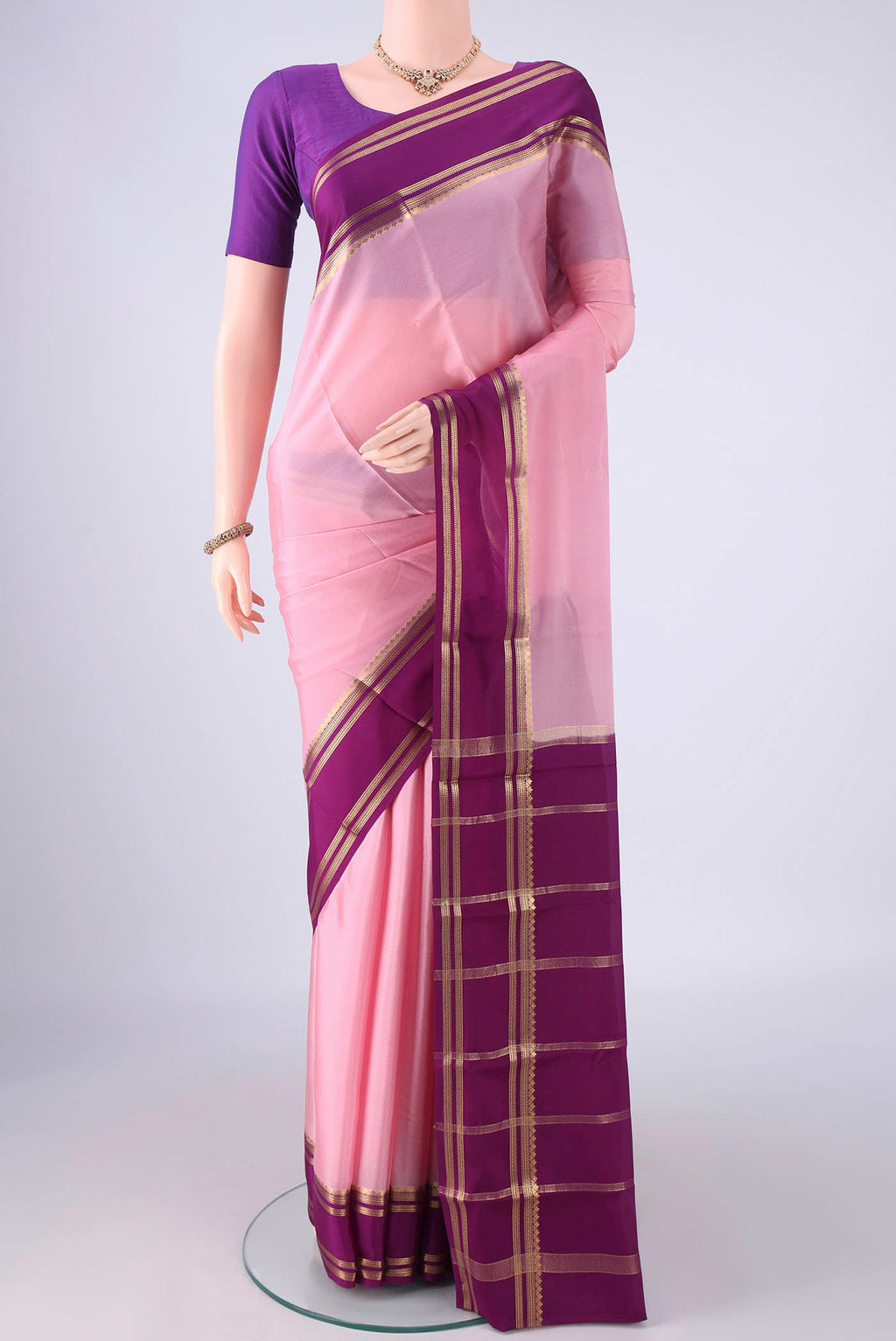Rose pink Mysore Crepe Saree with Plain Body and Zari Border.  displayed on a mannequin
