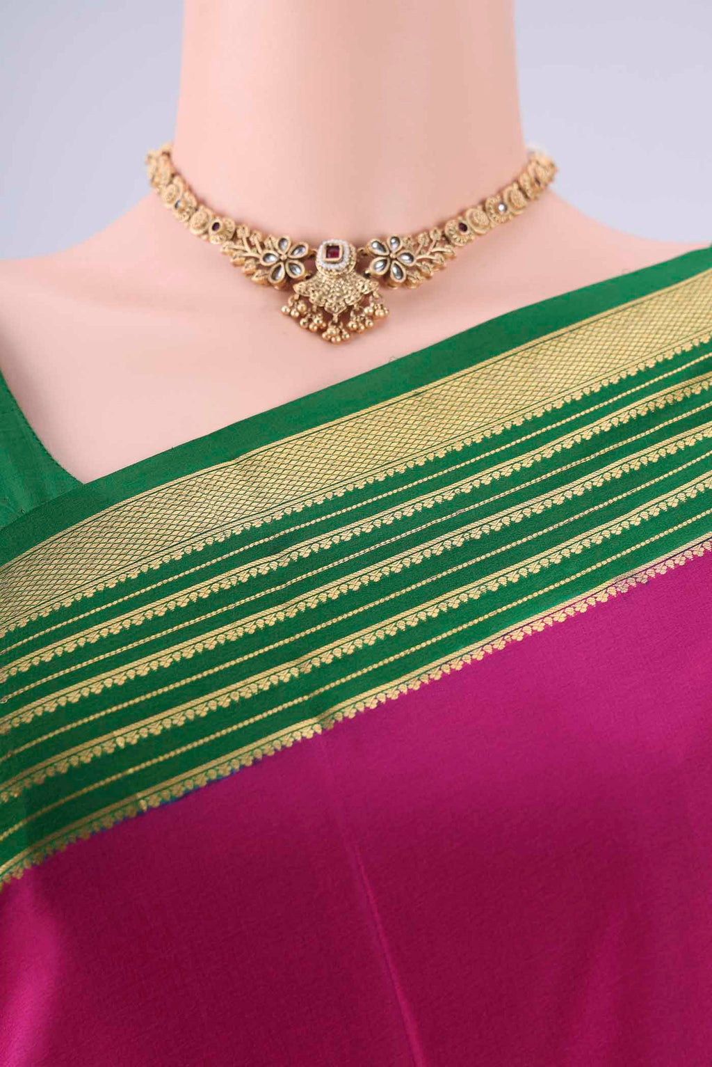 Border image of Rani Pink Mysore Crepe Saree with Plain Body and Zari Border. 