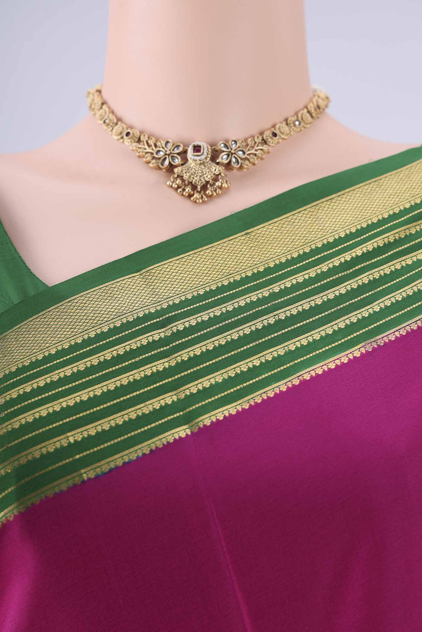 Border image of Rani Pink Mysore Crepe Saree with Plain Body and Zari Border. 