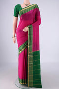 Rani Pink Mysore Crepe Saree with Plain Body and Zari Border.  displayed on a mannequin