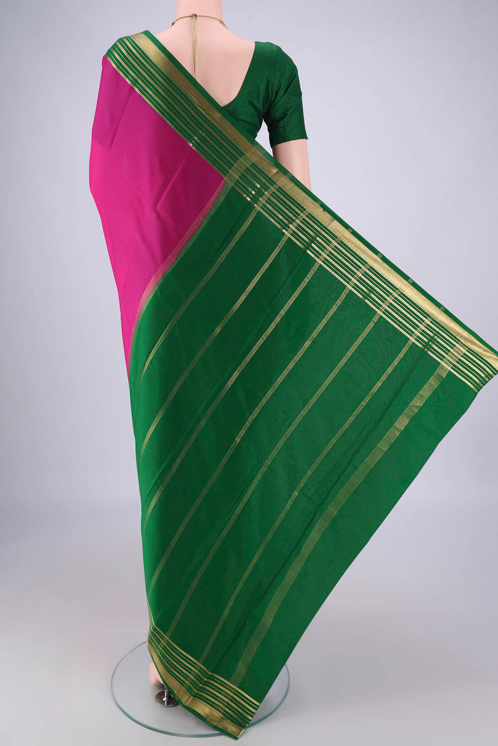 Flat view of Rani Pink Mysore Crepe Saree with Plain Body and Zari Border. 
