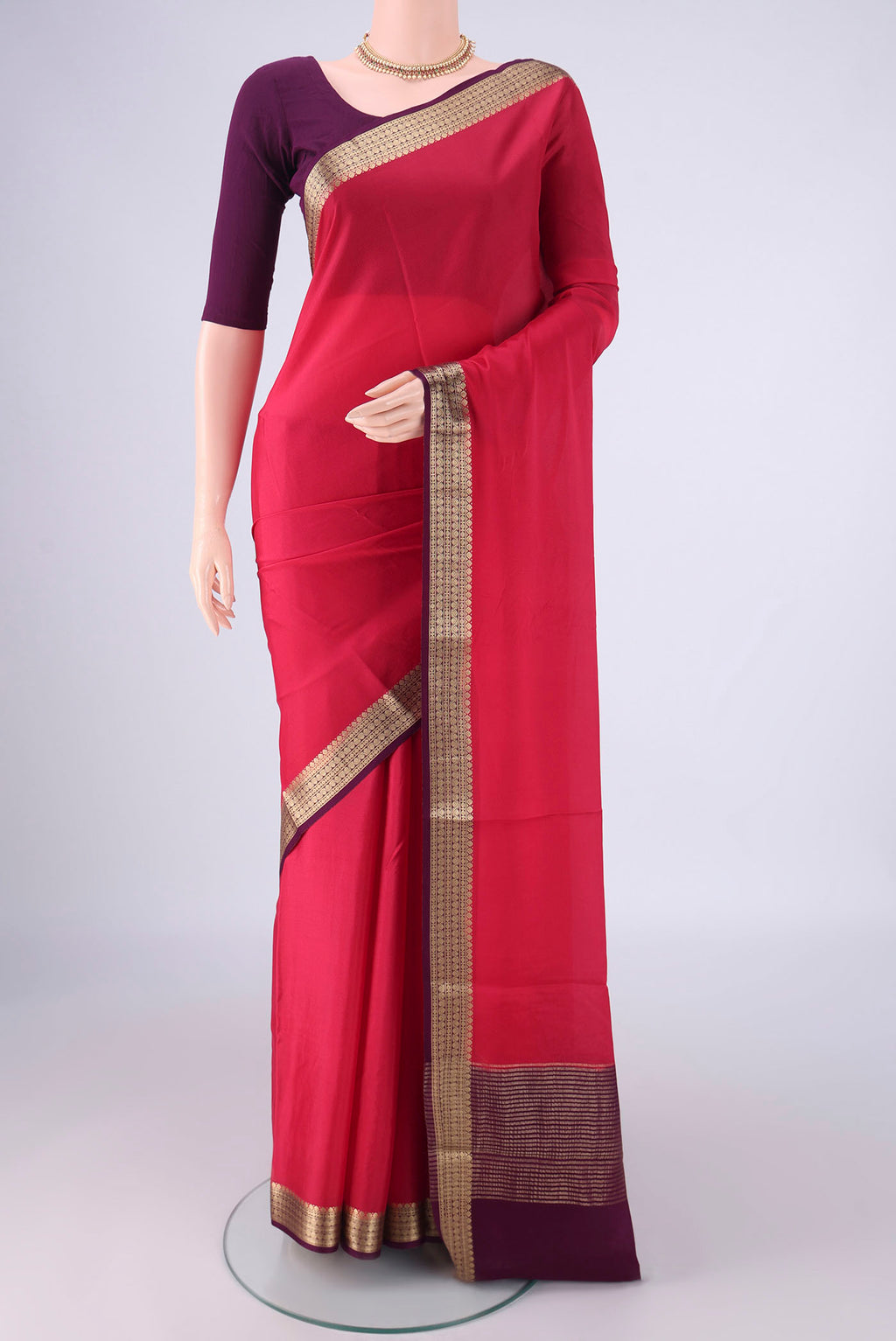Pink Mysore Crepe Saree with Plain Body and Zari Border.  displayed on a mannequin