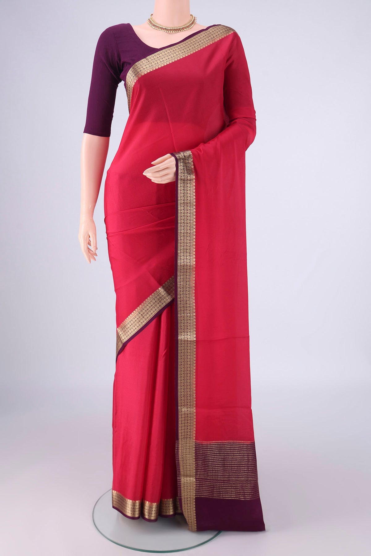 Pink Mysore Crepe Saree with Plain Body and Zari Border.  displayed on a mannequin