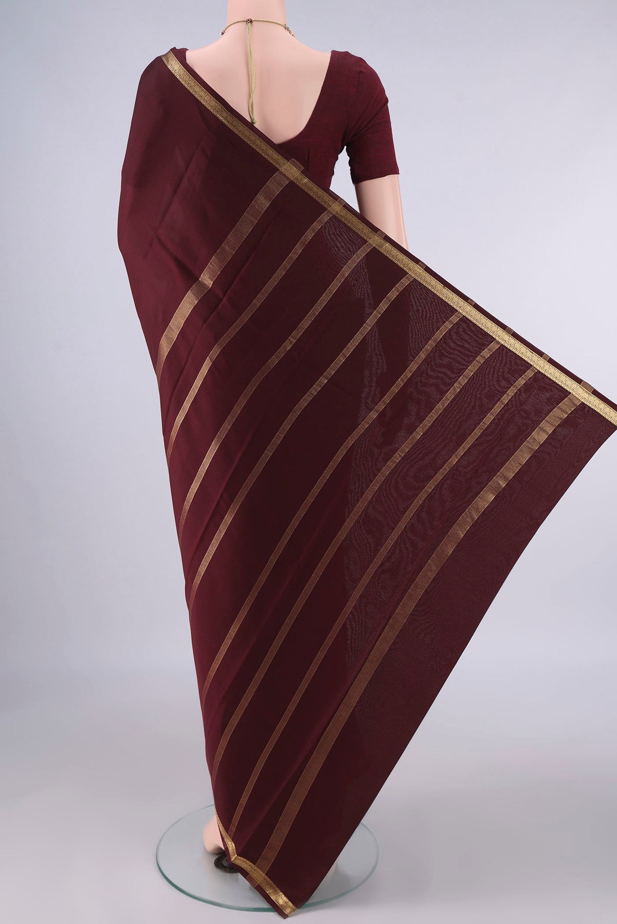 Flat view of Coffee Brown Mysore Crepe Saree with Plain Body and Zari Border. 