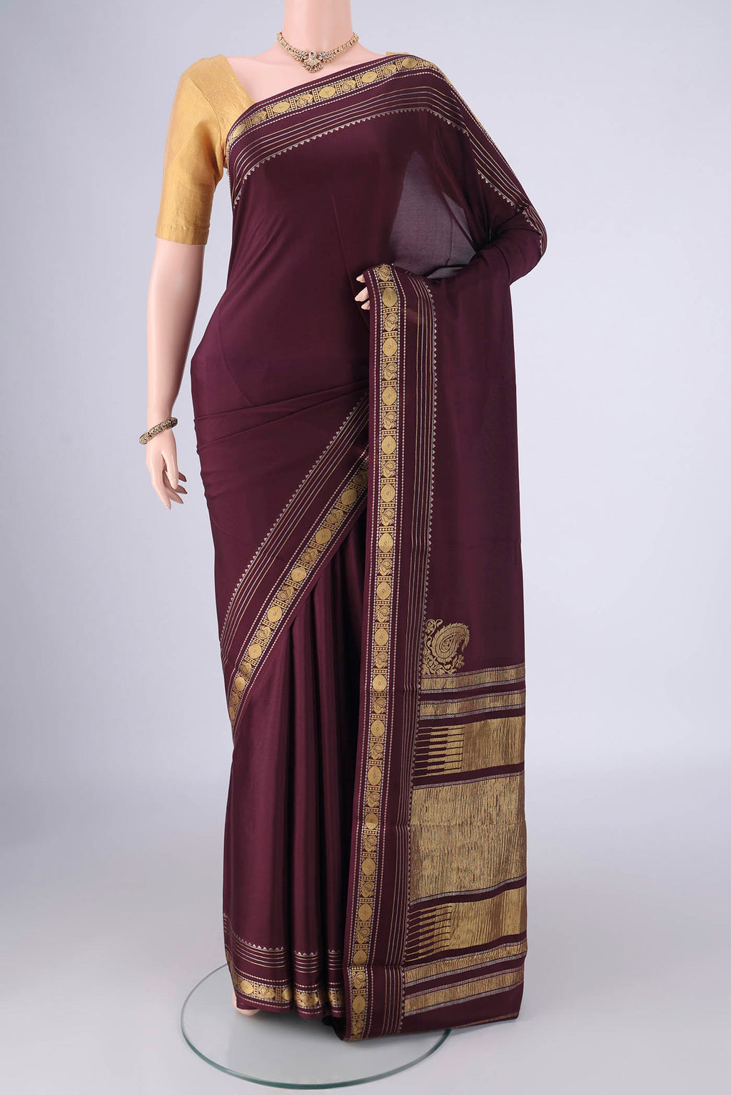 Coffee Brown Mysore Crepe Saree with Plain Body and Zari Border.  displayed on a mannequin