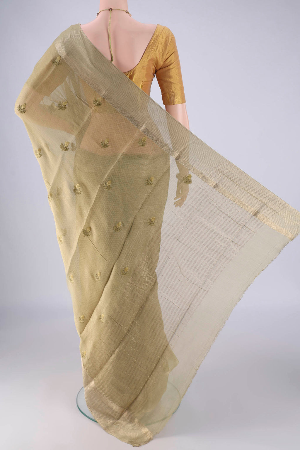 Flat view of Beige Mysore Georgette Saree with Embroidery on the body and Zari Border. 