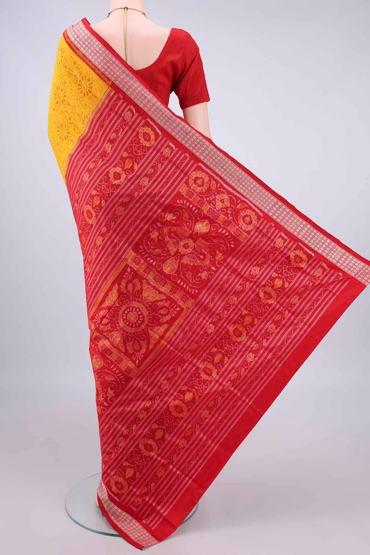 Flat view of Pure Silk Yellow Orissa Saree with Pure Ikat on the body and Thread Border. 