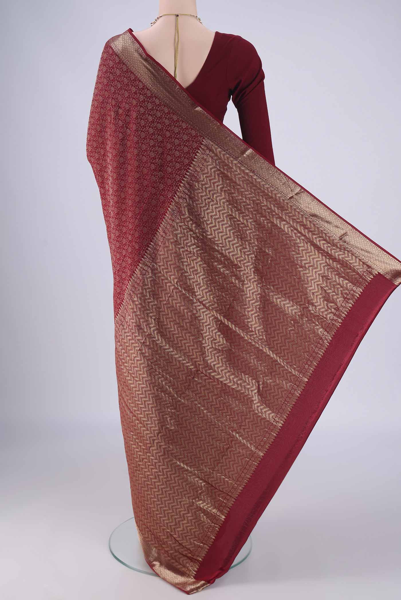 Flat view of Maroon Mysore Crepe Saree with Zari Brocade on the body and Zari Border. 