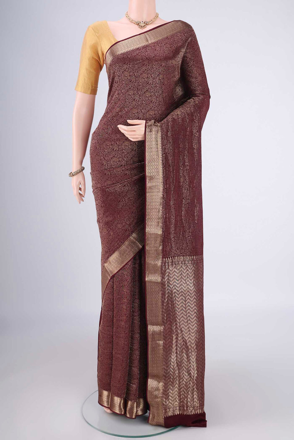 Coffee Brown Mysore Crepe Saree with Zari Brocade on the body and Zari Border.  displayed on a mannequin