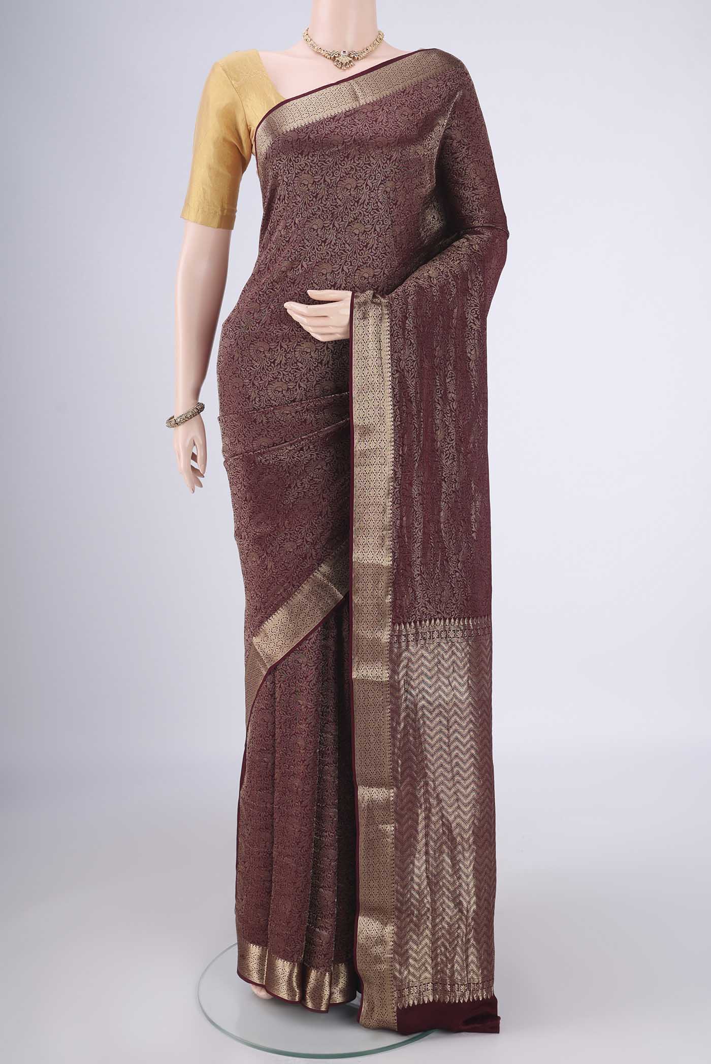 Coffee Brown Mysore Crepe Saree with Zari Brocade on the body and Zari Border.  displayed on a mannequin